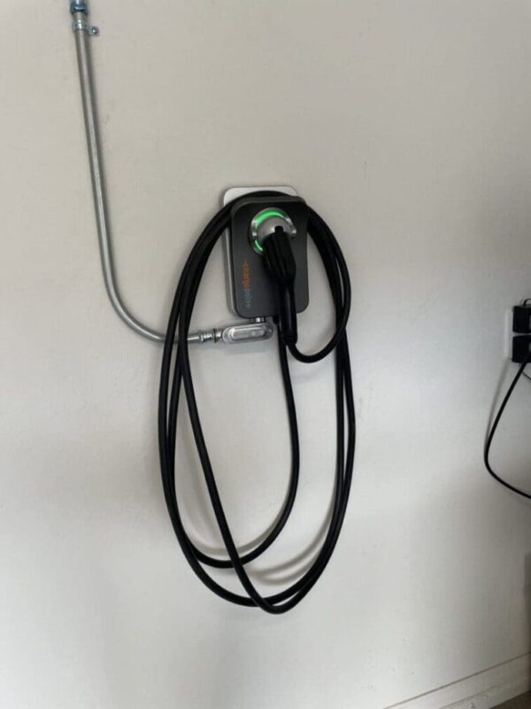 Electric vehicle charger with cord.