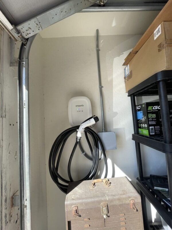 Garage electric car charging station setup.