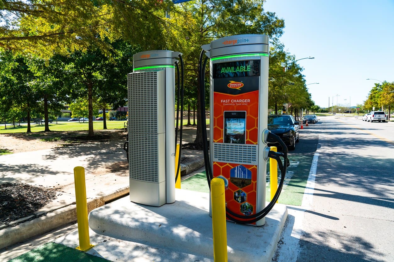 A gas pump on the side of the road.