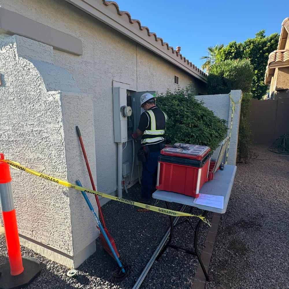 We carefully mark off the work area during an EV home charger installation.
